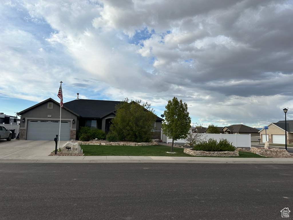 View of front of home featuring a garage