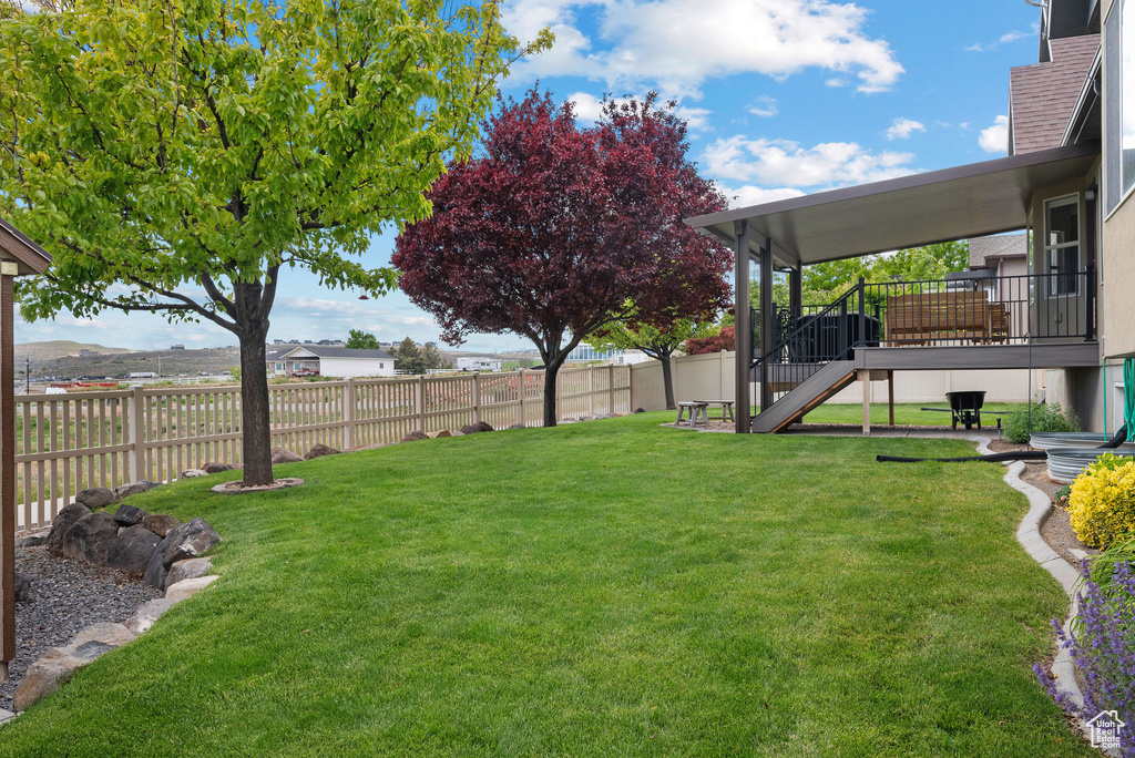 View of yard featuring stairs