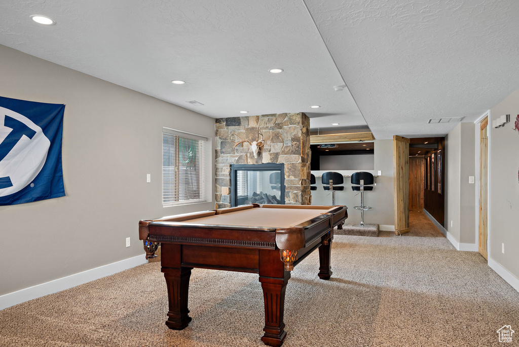 Game room featuring billiards table, carpet floors, baseboards, recessed lighting, and a textured ceiling