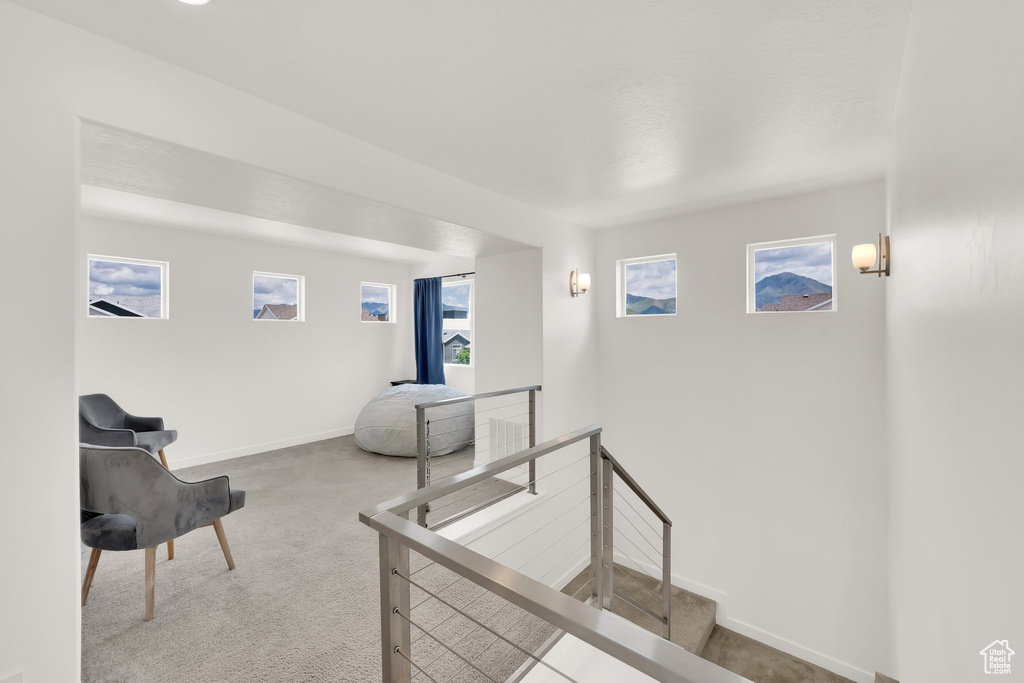 Staircase featuring carpet floors and baseboards