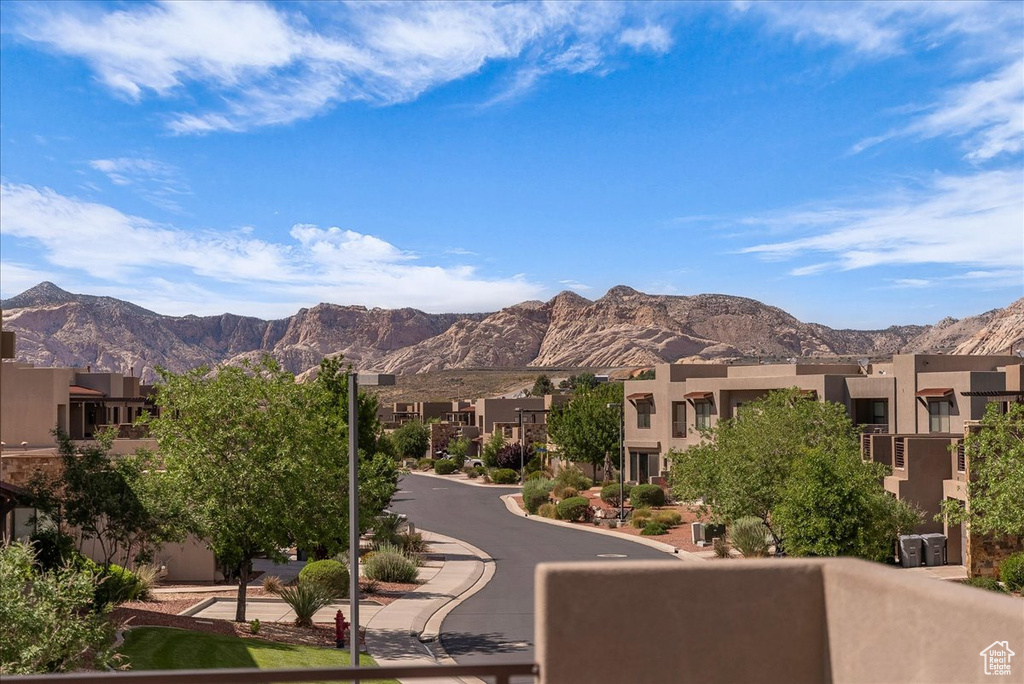 View of mountain backdrop featuring nearby suburban area