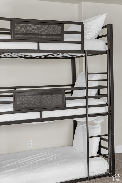 Unfurnished bedroom with carpet and baseboards