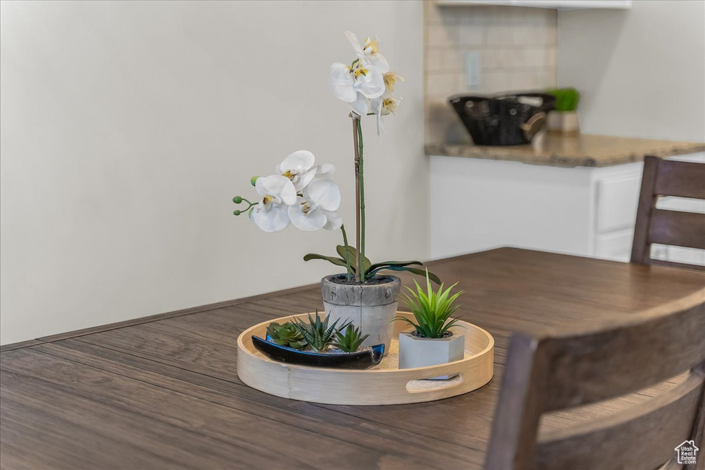 Dining room featuring wood finished floors and baseboards