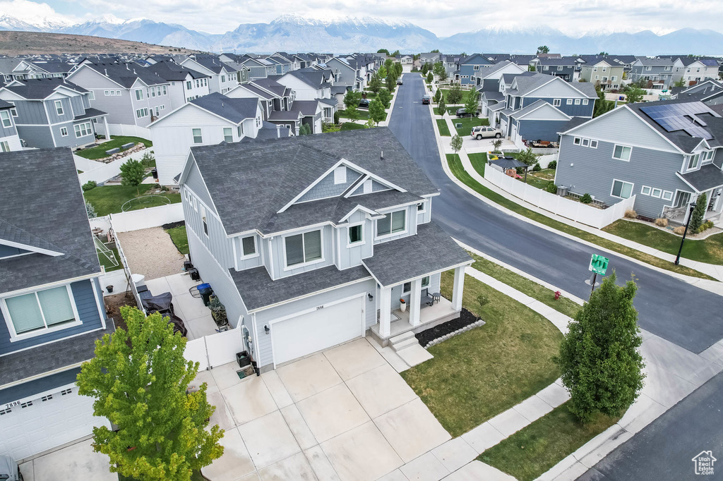Aerial view of residential area featuring mountains