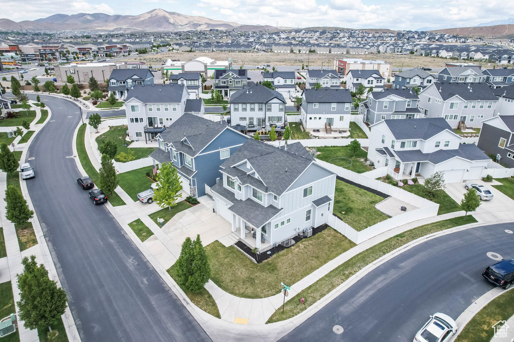 Aerial perspective of suburban area with a mountainous background