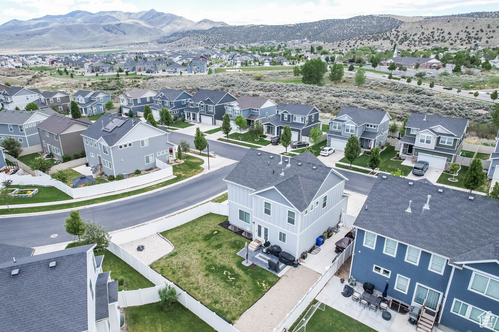 Aerial view of residential area featuring a mountainous background