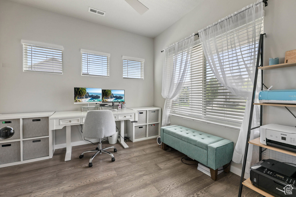 Home office with wood finished floors
