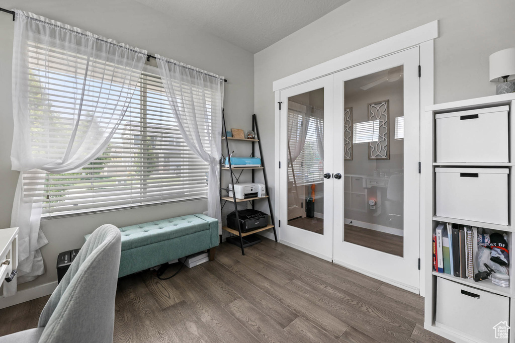Living area with french doors and wood finished floors