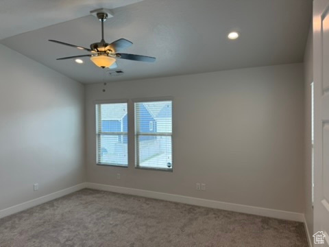 Carpeted spare room featuring baseboards, a ceiling fan, and recessed lighting