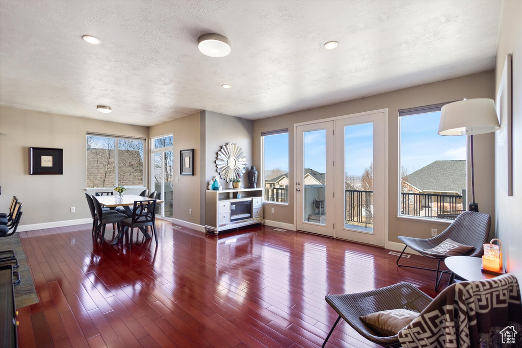 Dining space featuring baseboards, wood-type flooring, and recessed lighting