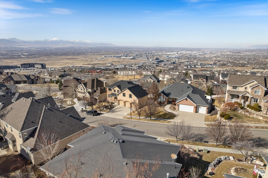 Aerial perspective of suburban area with a mountain backdrop