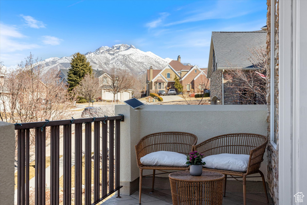 Balcony featuring a mountain view and a residential view