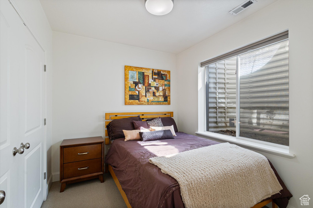 Bedroom with light carpet