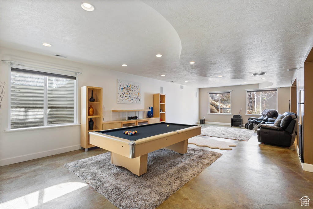 Game room featuring baseboards, finished concrete floors, recessed lighting, billiards, and healthy amount of natural light
