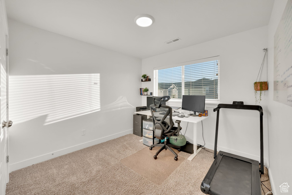 Office featuring baseboards and carpet floors