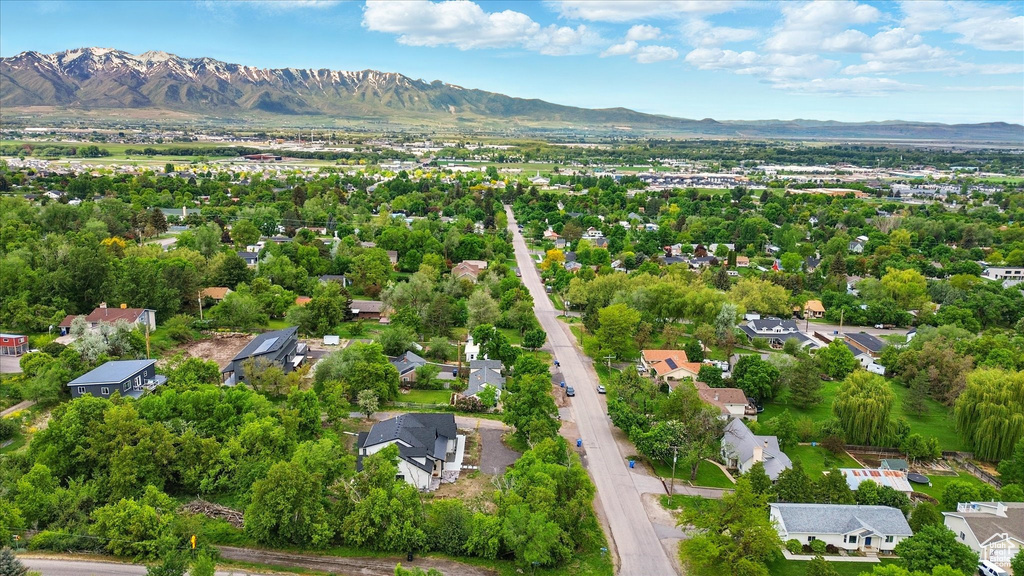 Aerial perspective of suburban area with a mountainous background