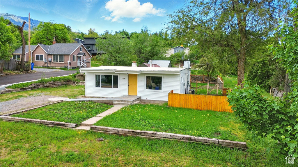 View of front of home featuring a chimney