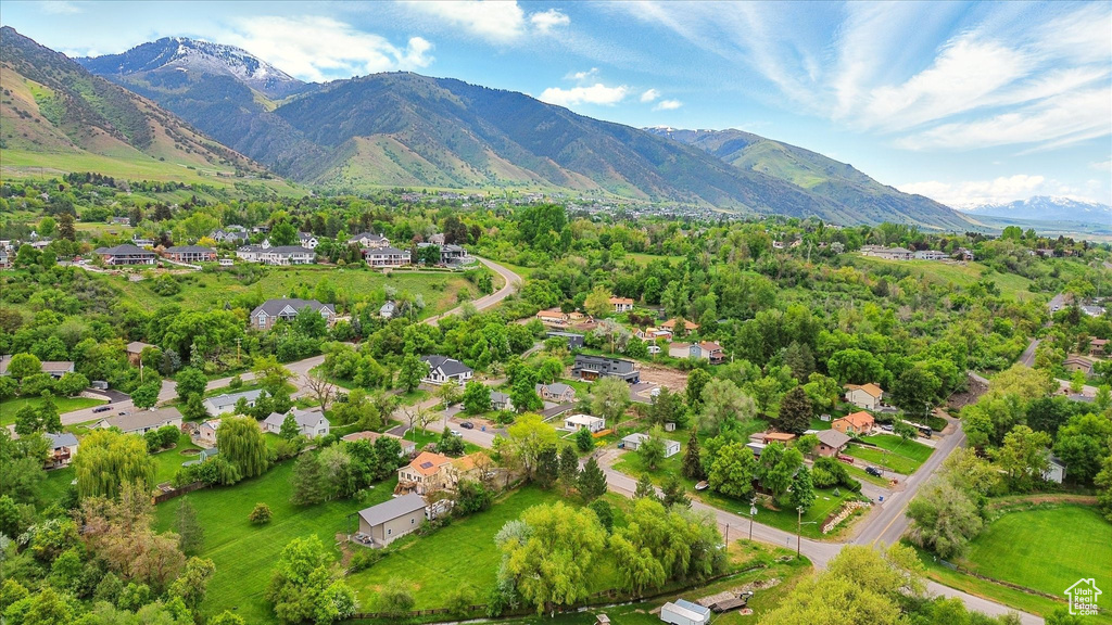 Aerial perspective of suburban area with a mountainous background