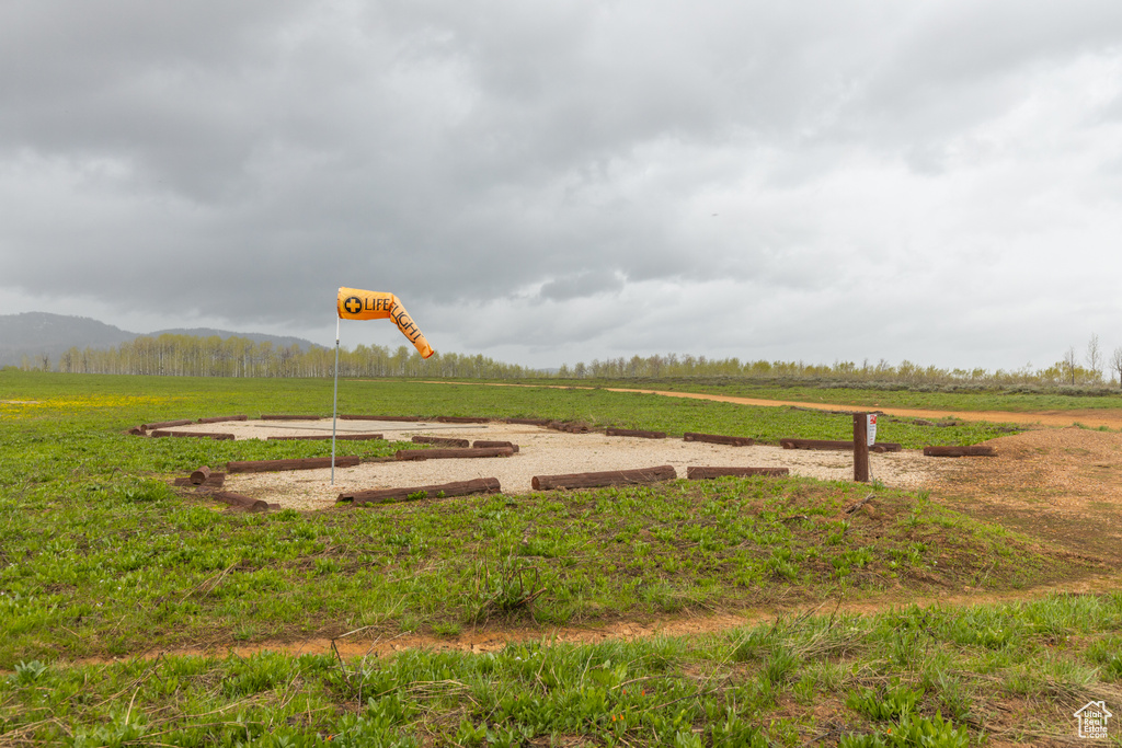 View of yard featuring a view of countryside and a mountain view