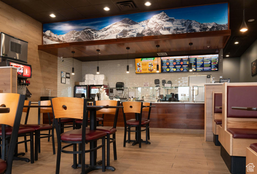 Bar featuring light wood-style floors