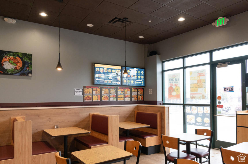 Common area with a drop ceiling and recessed lighting