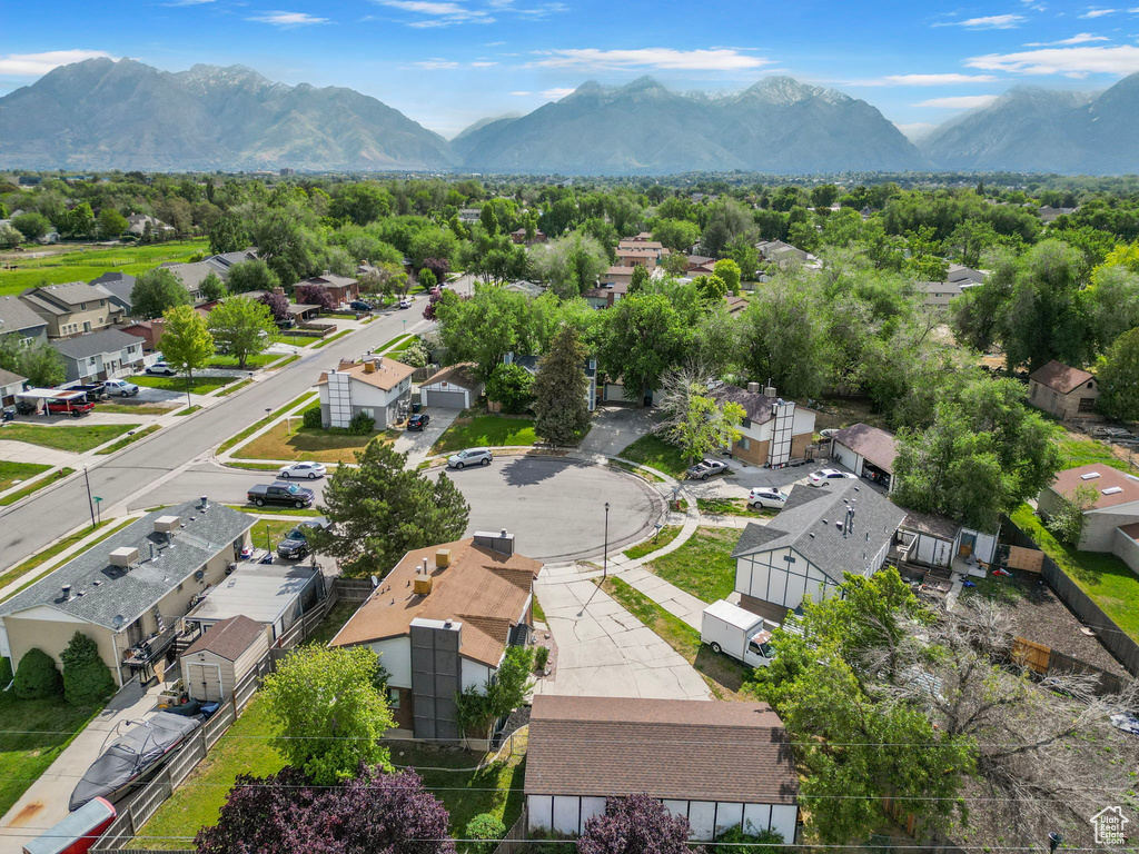 Aerial perspective of suburban area with a mountainous background