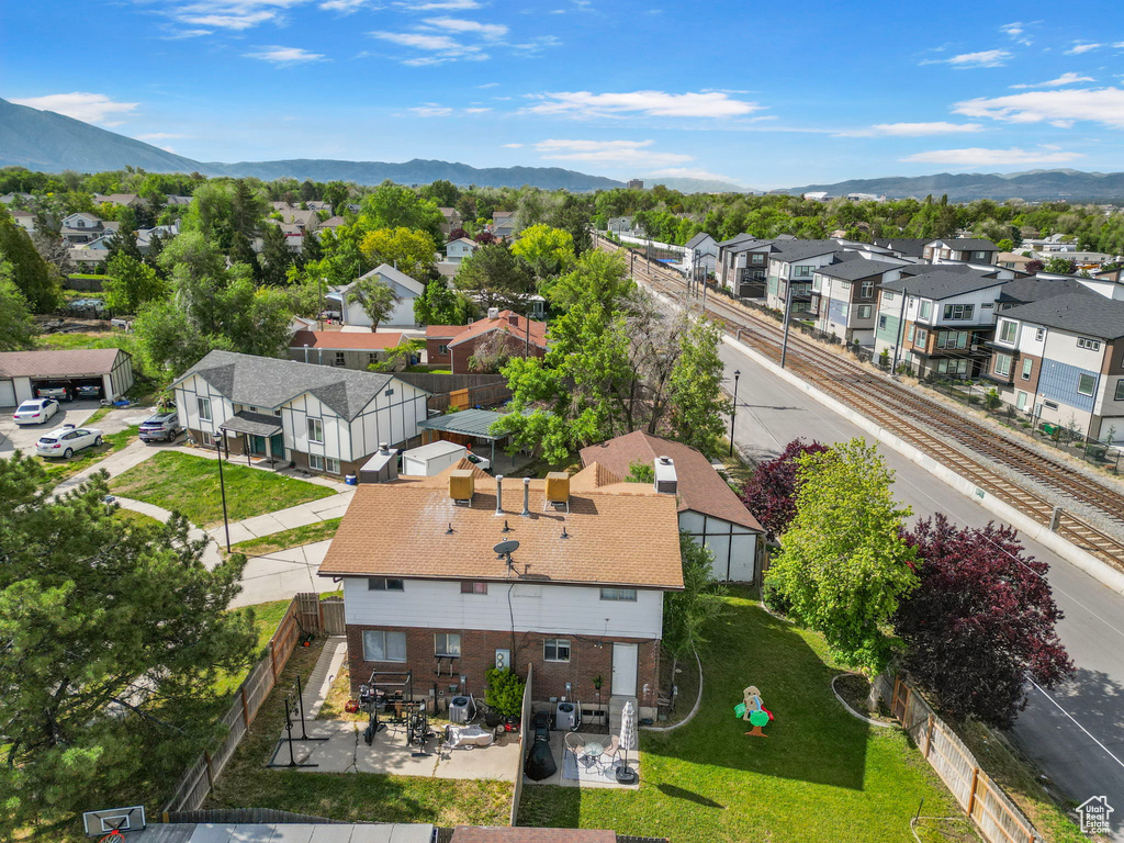 Aerial perspective of suburban area with a mountain backdrop