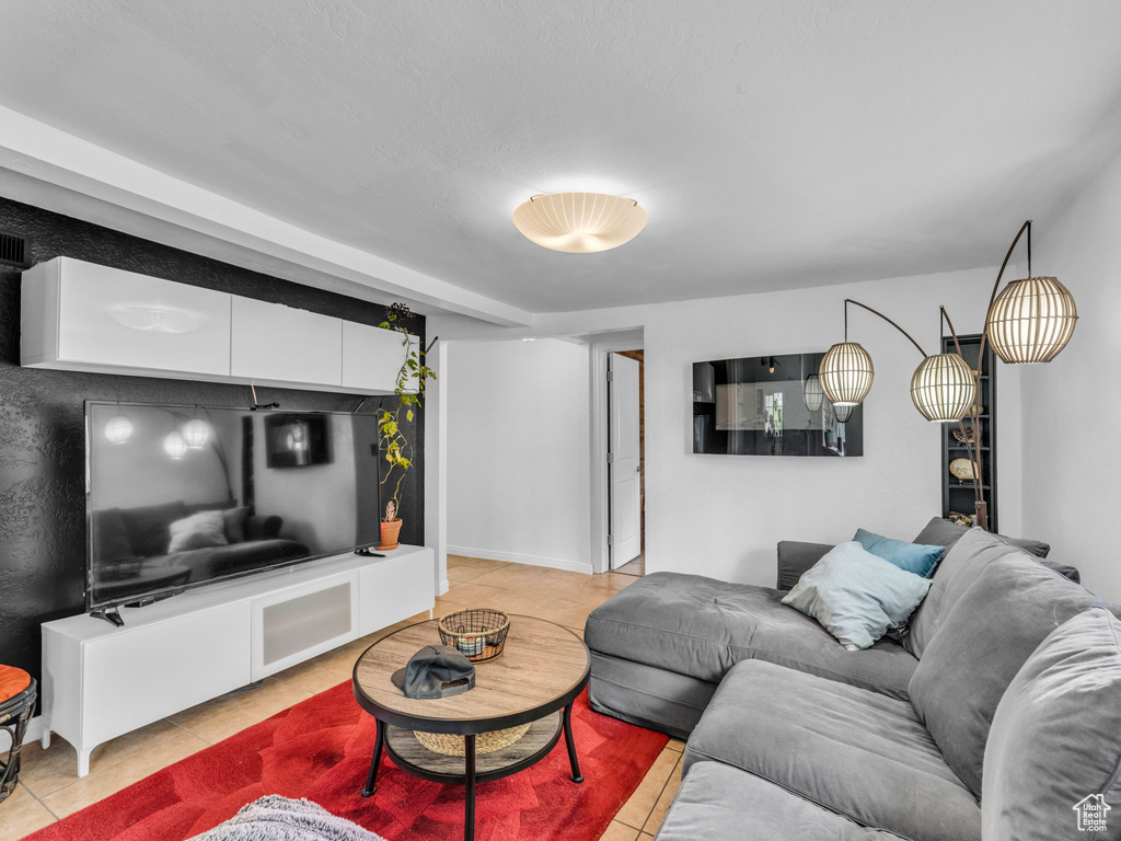 Living area with light tile patterned flooring