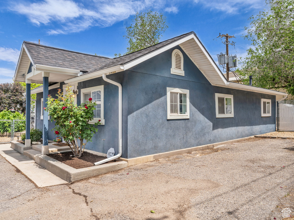 View of side of property featuring stucco siding
