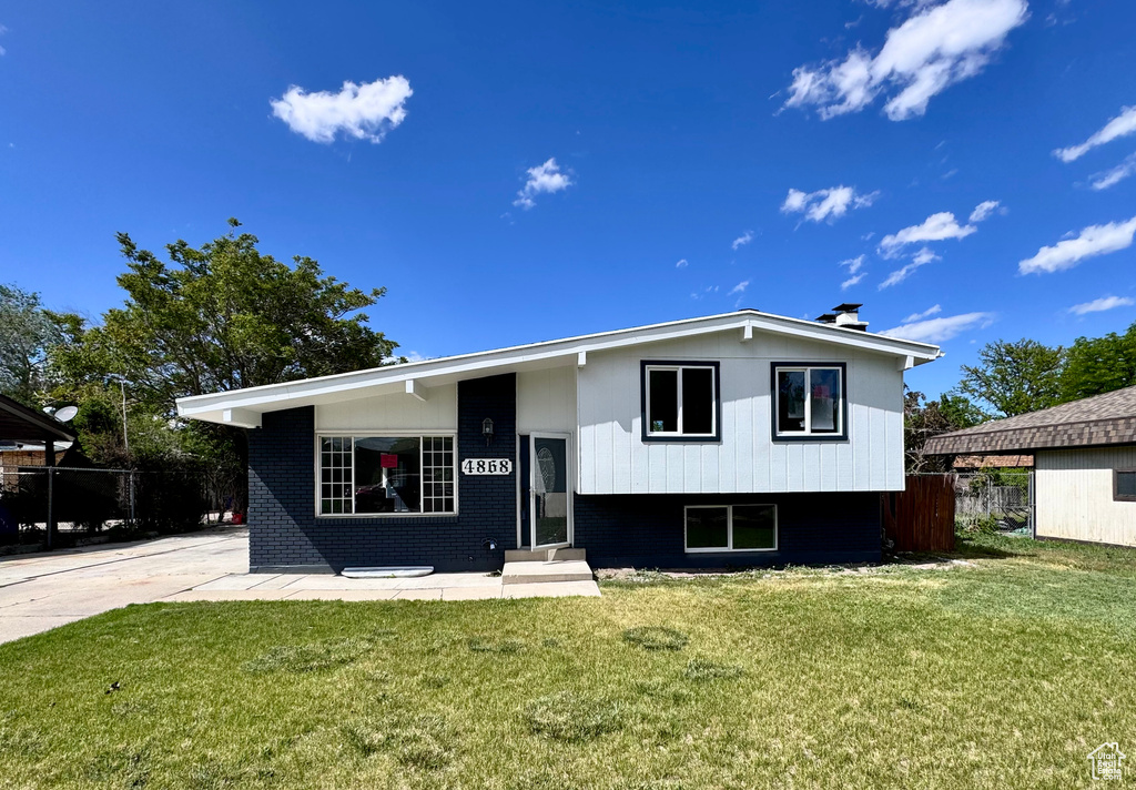 View of front of property with entry steps and brick siding