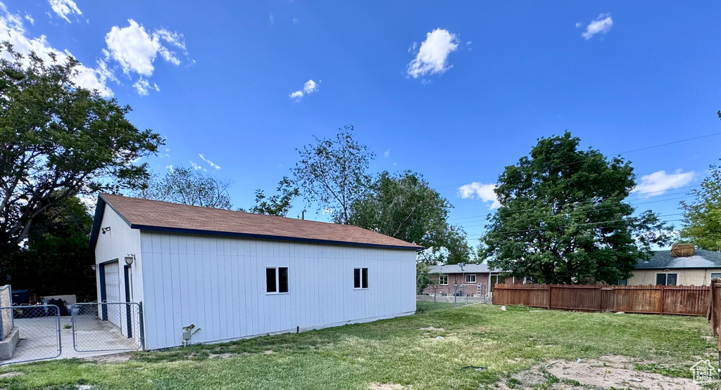 View of side of property featuring an outdoor structure