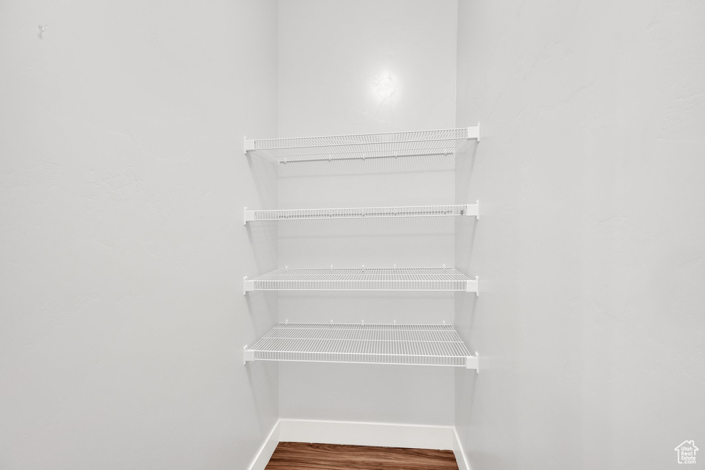 Detailed view of baseboards and wood finished floors