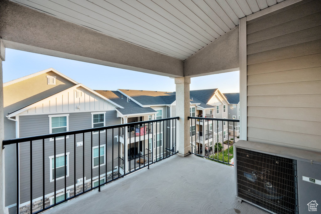 Balcony featuring a residential view and central AC