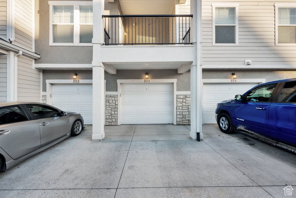 Garage featuring driveway