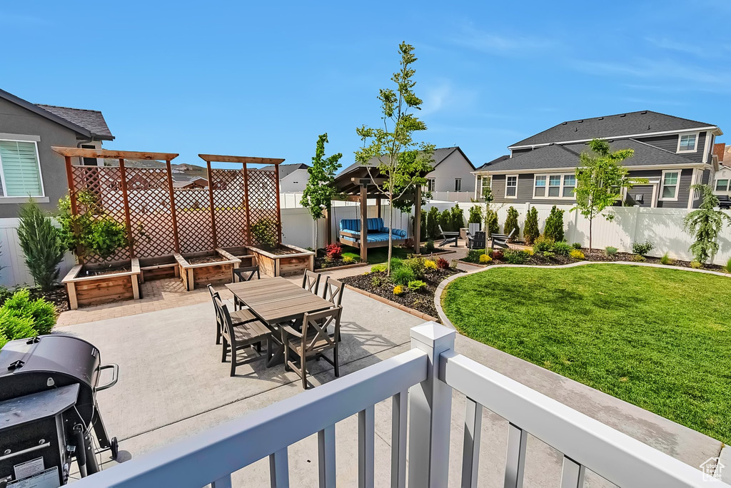View of patio with a residential view, outdoor dining area, and area for grilling