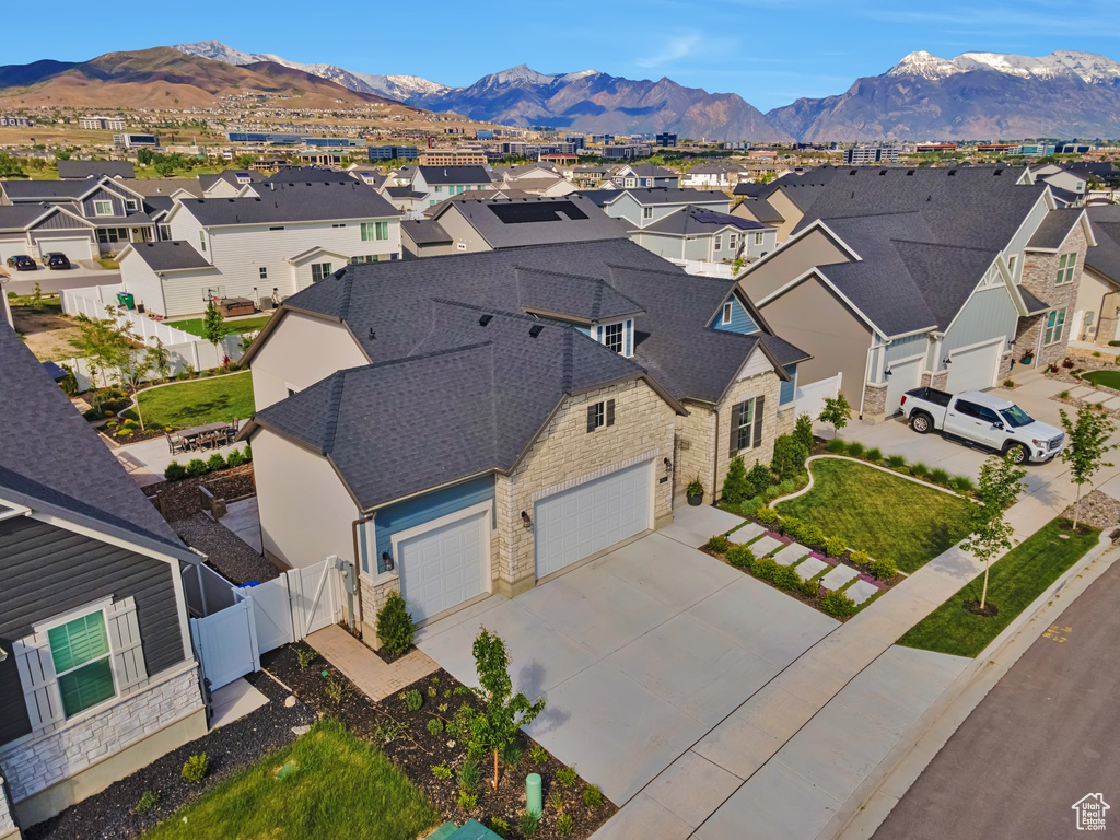 Aerial perspective of suburban area with a mountain backdrop