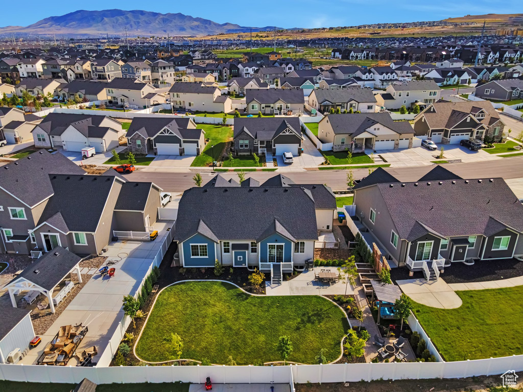 Aerial perspective of suburban area with a mountainous background