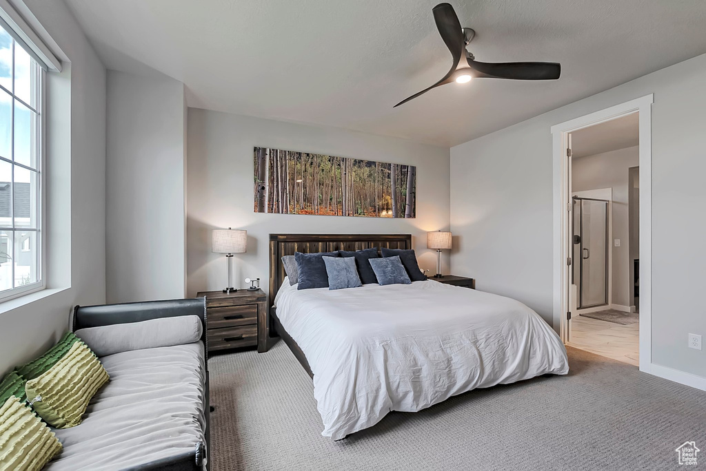 Bedroom with carpet floors, a ceiling fan, and baseboards