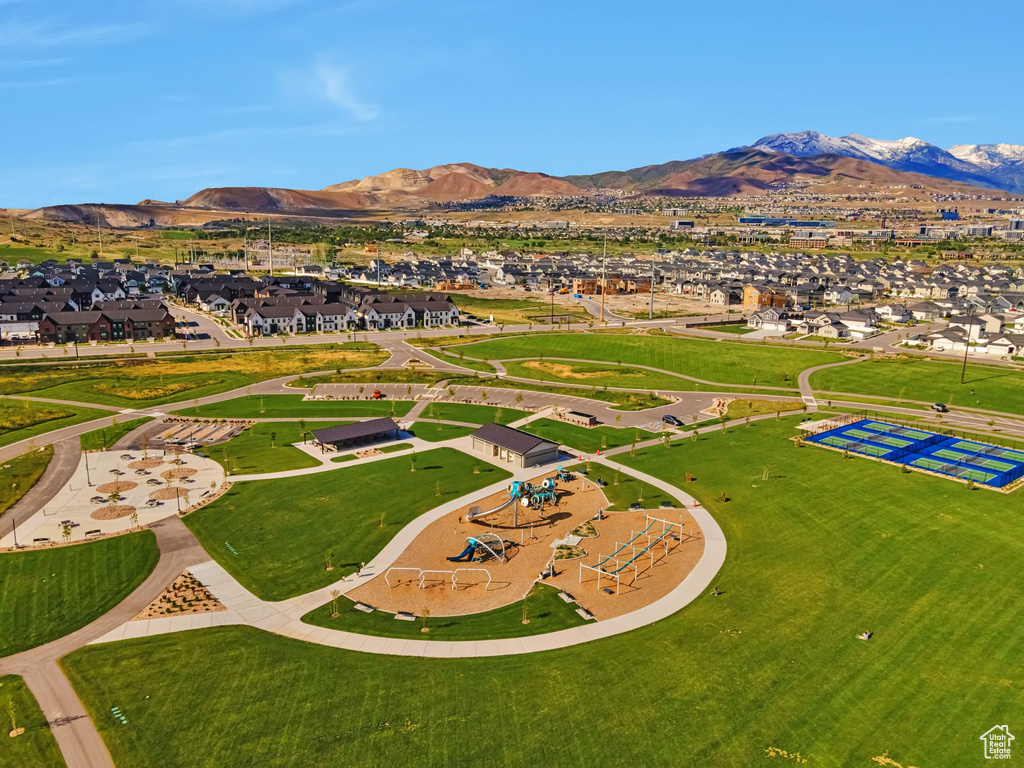Aerial view of residential area featuring a mountain backdrop