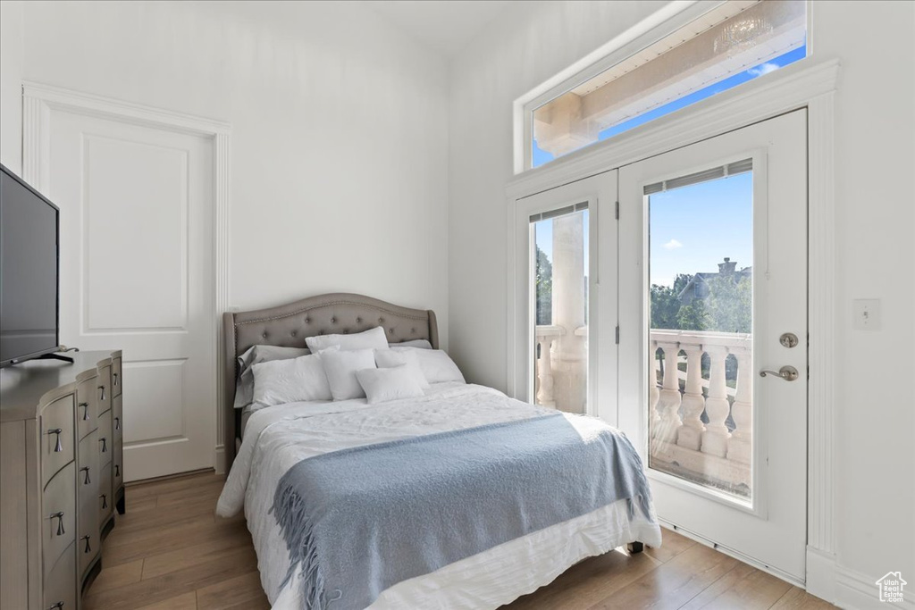 Bedroom with access to outside and light wood-type flooring