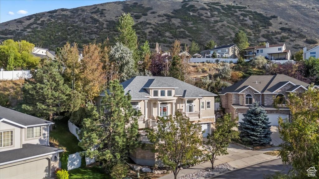 Aerial view of residential area with a mountainous background