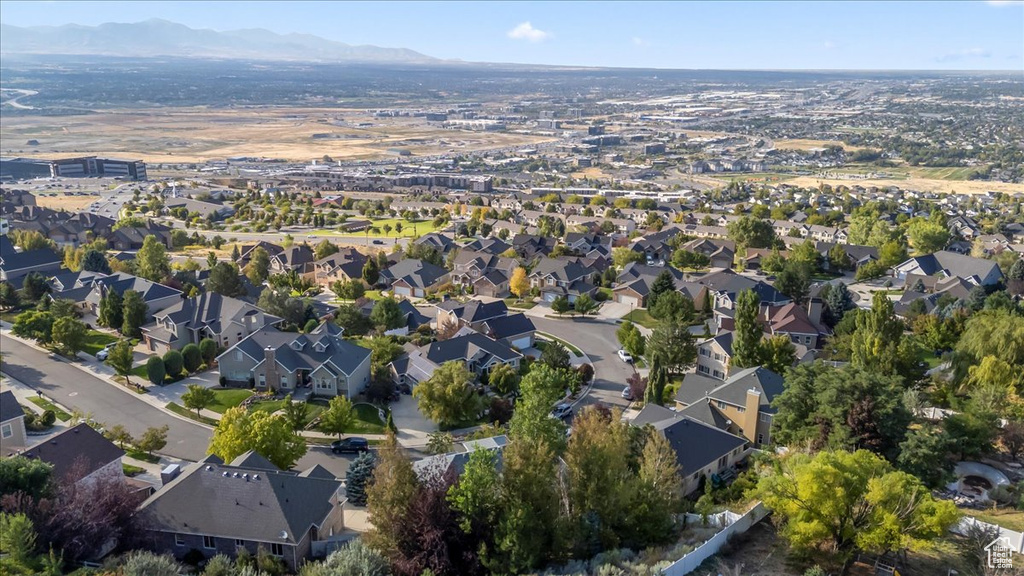 View of property location with a mountain backdrop and nearby suburban area