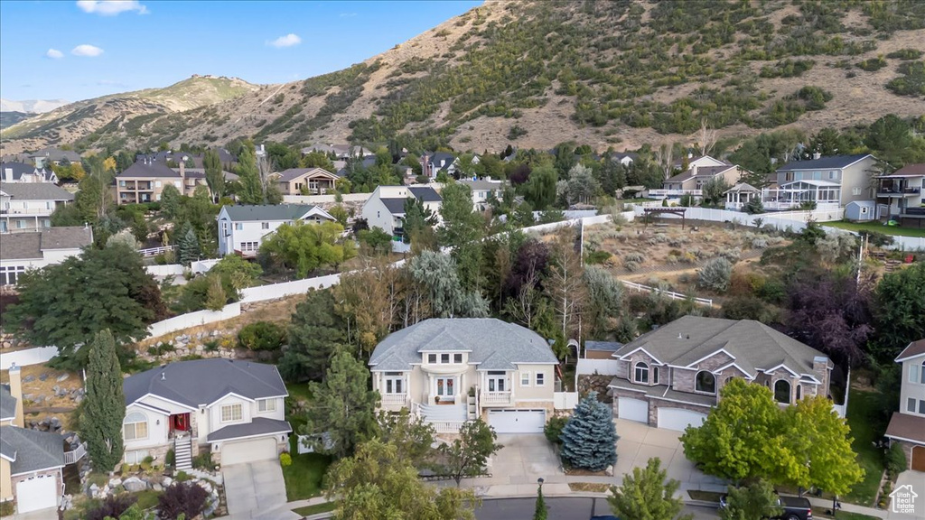 Aerial view of residential area featuring mountains