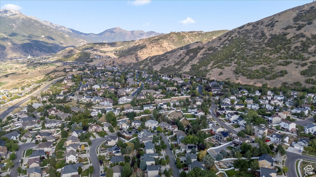 Aerial view of property's location with a mountainous background