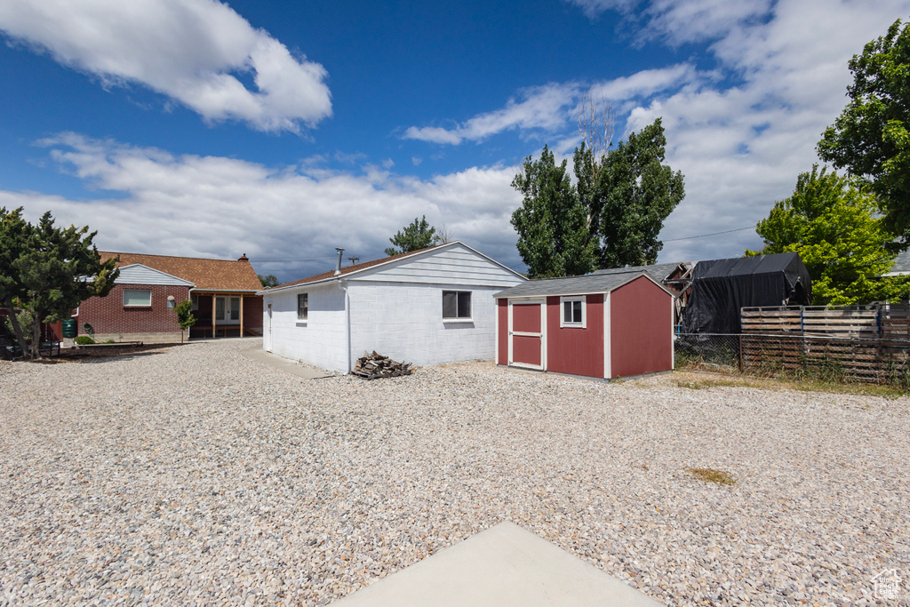 Back of house with concrete block siding