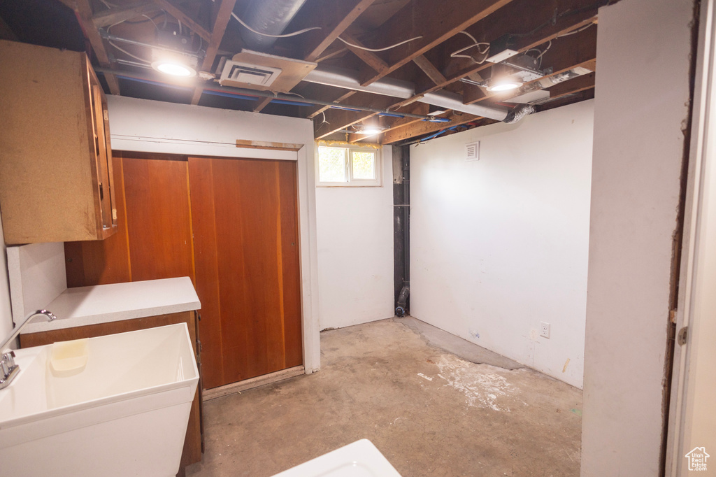 Below grade area with a sink