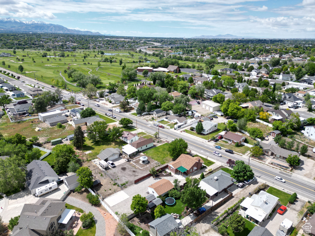 Aerial perspective of suburban area featuring a mountainous background