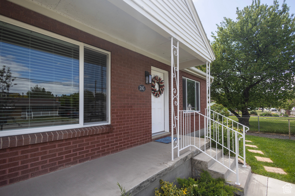 Entrance to property with brick siding