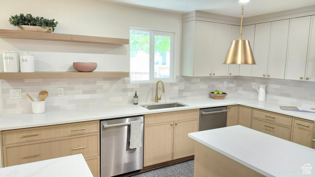 Kitchen with open shelves, stainless steel dishwasher, a sink, light brown cabinets, and decorative backsplash