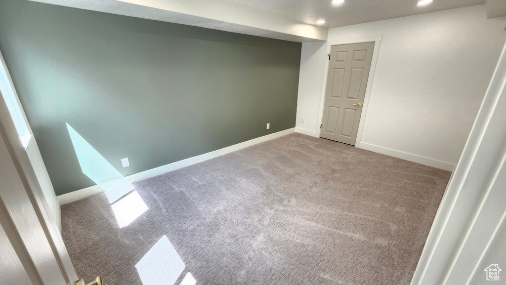 Unfurnished room with carpet floors, recessed lighting, and baseboards